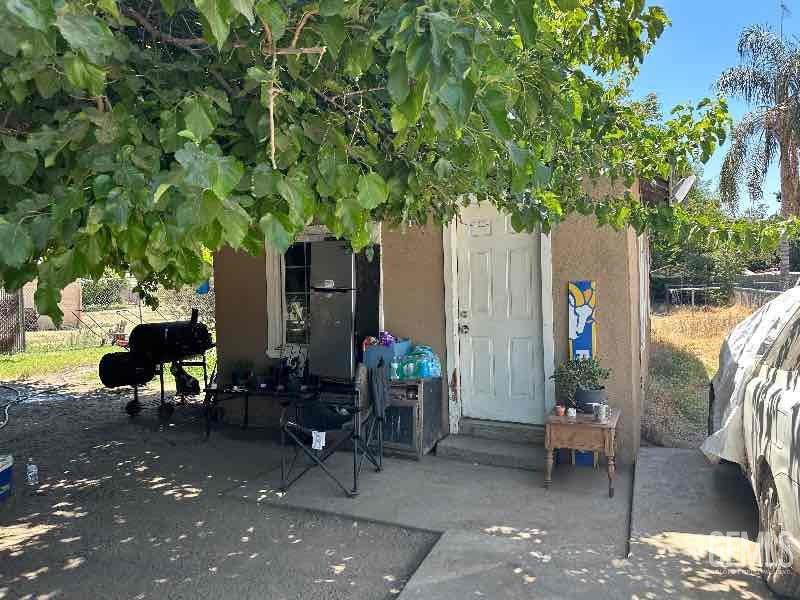 a view of a chairs and tables in a patio