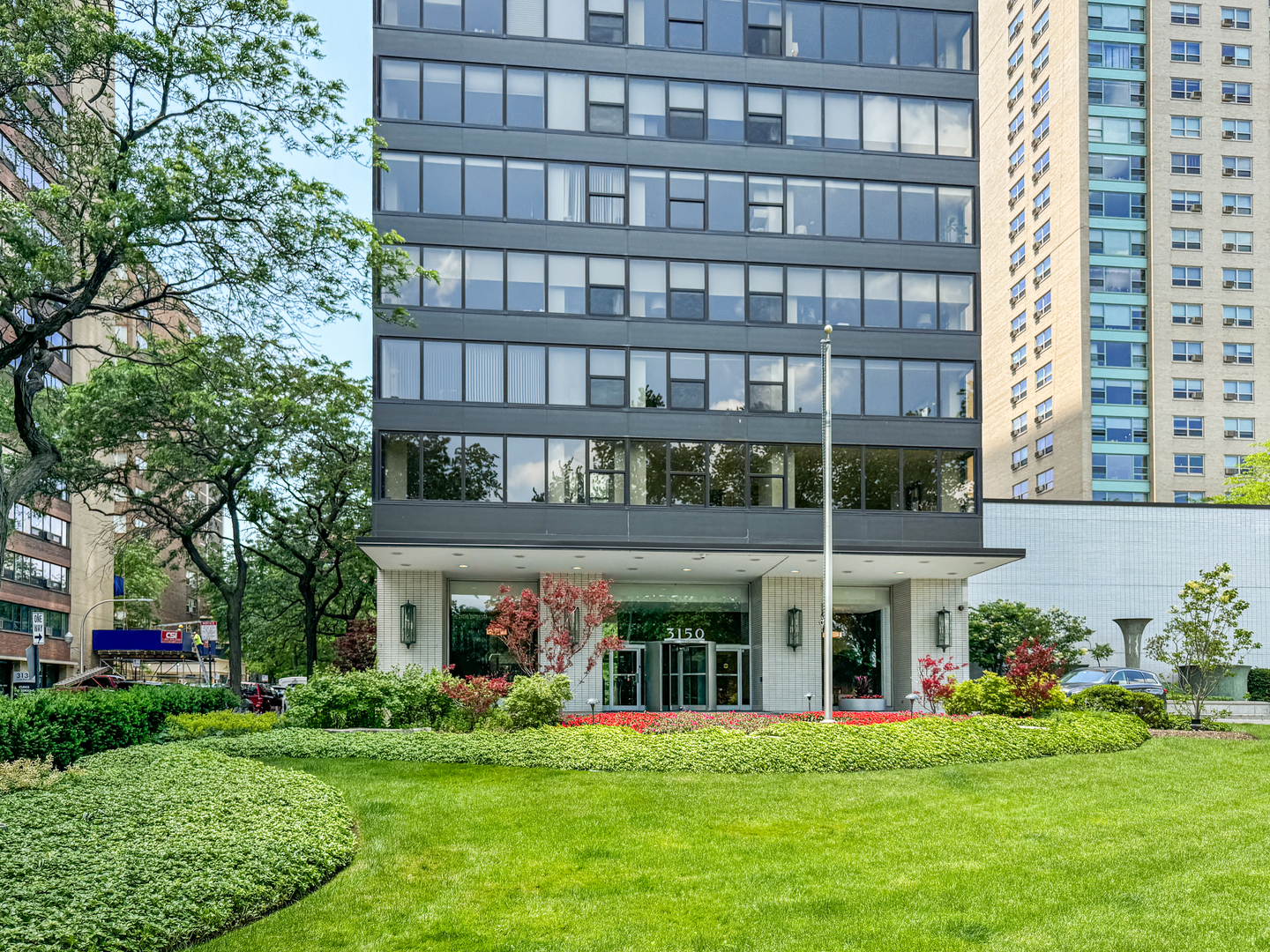 a view of a building with a yard