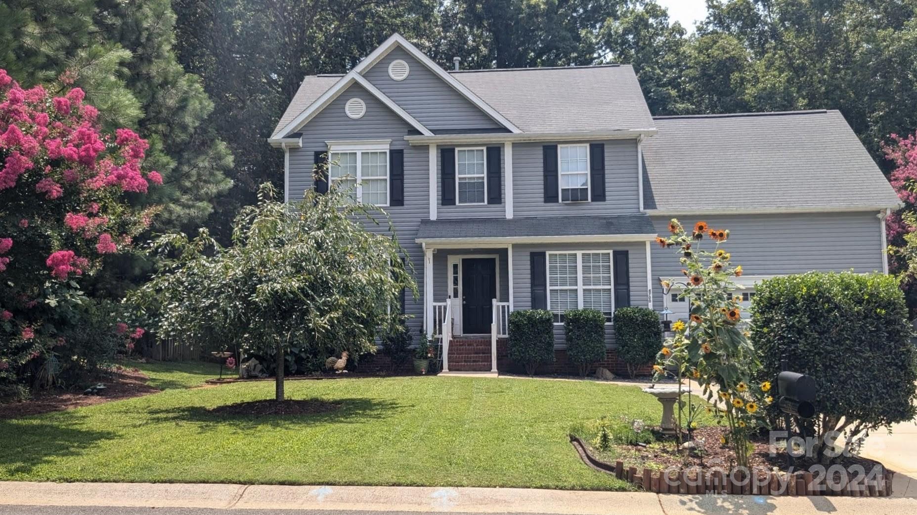 front view of a house with a yard