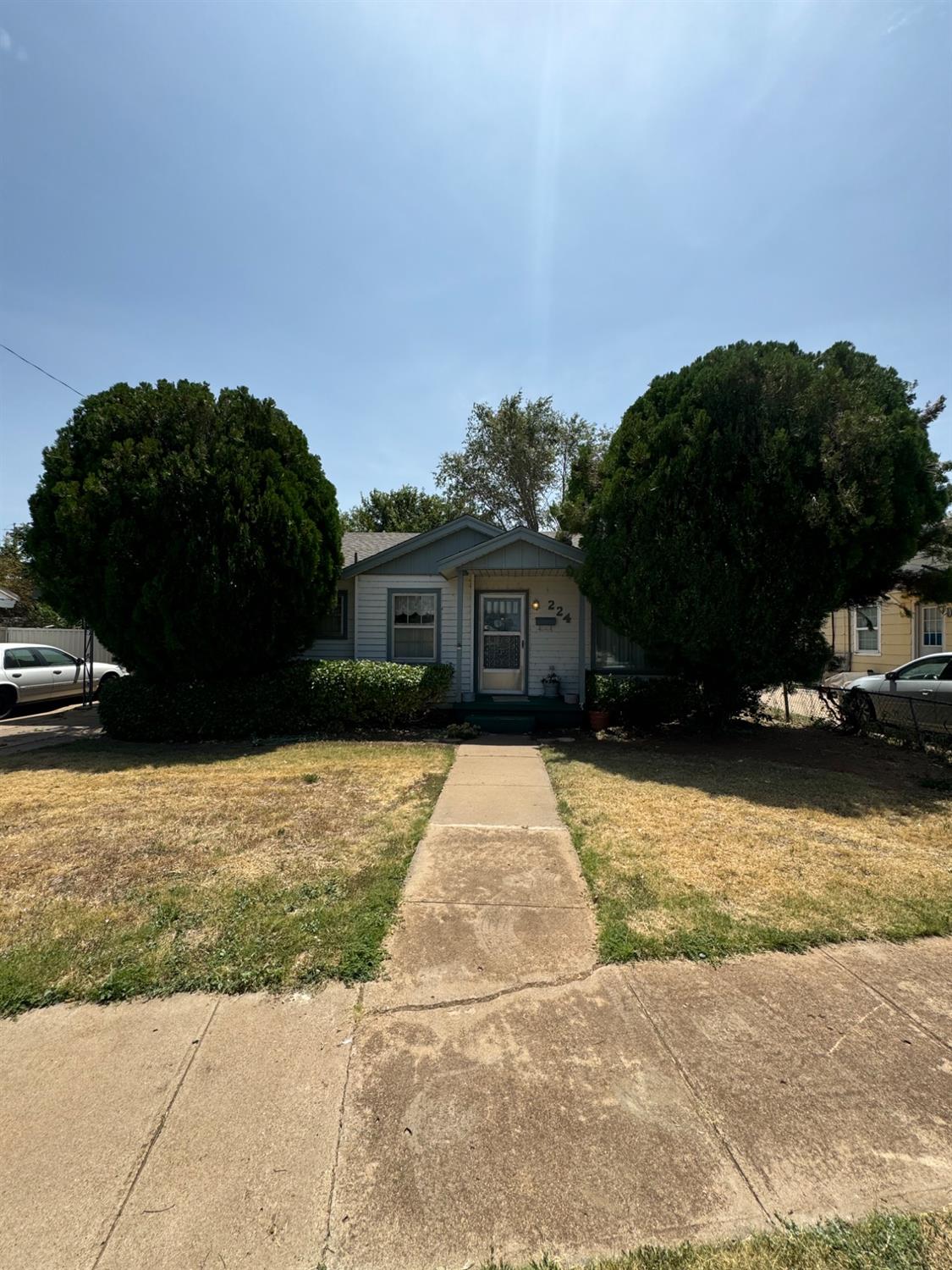 a house view with a garden space