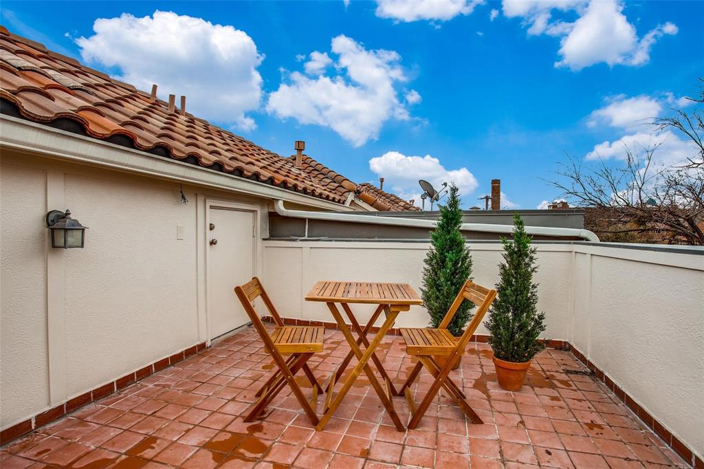 a view of a terrace with furniture and a potted plant