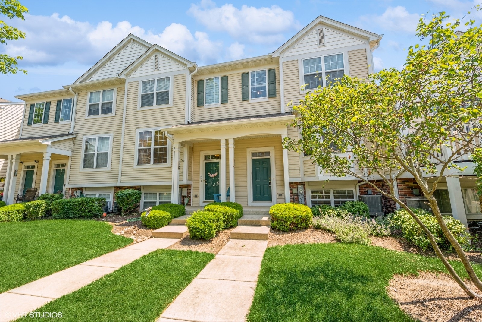 a front view of a house with a yard