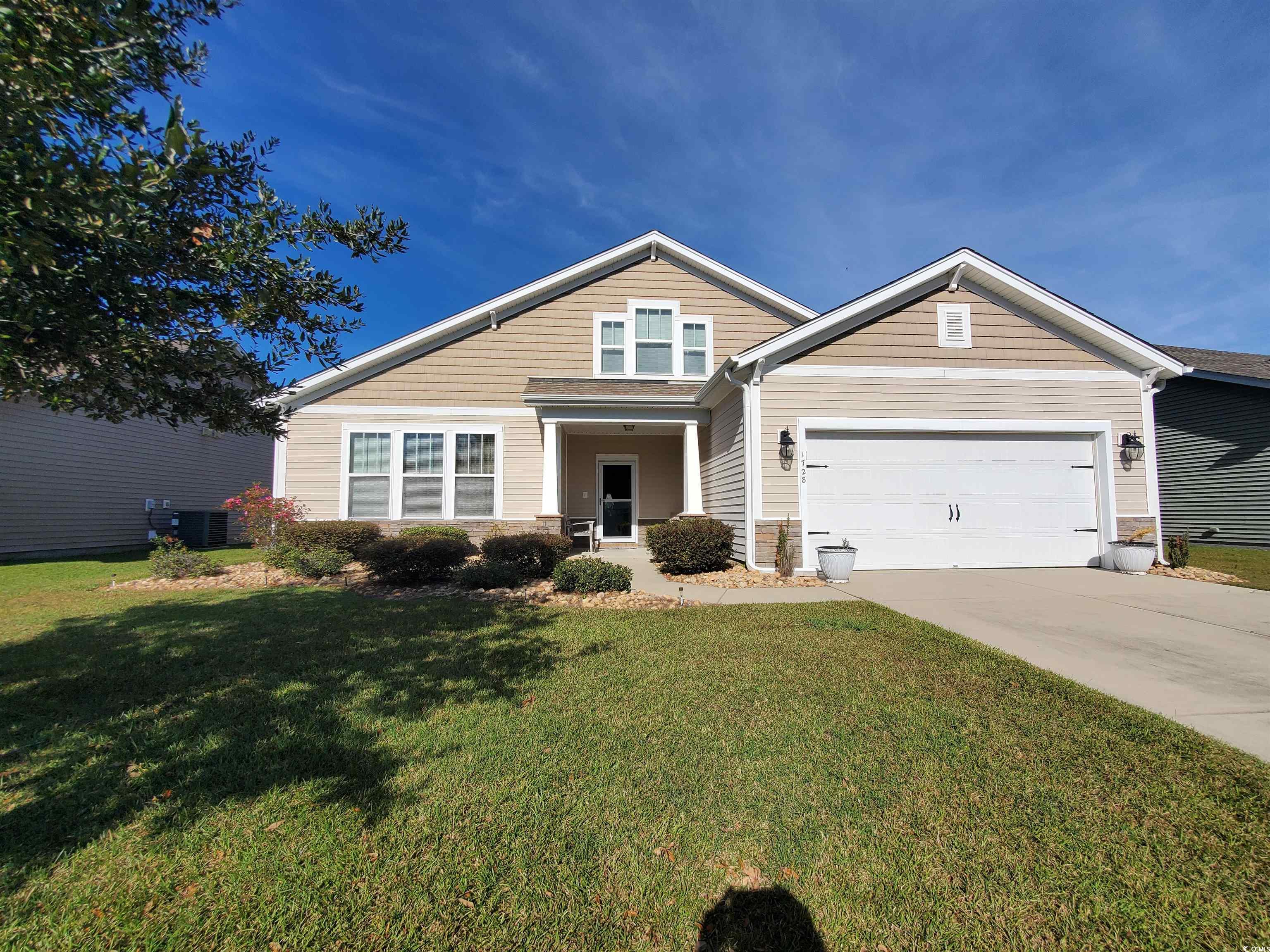 Craftsman-style home with a 2 car garage