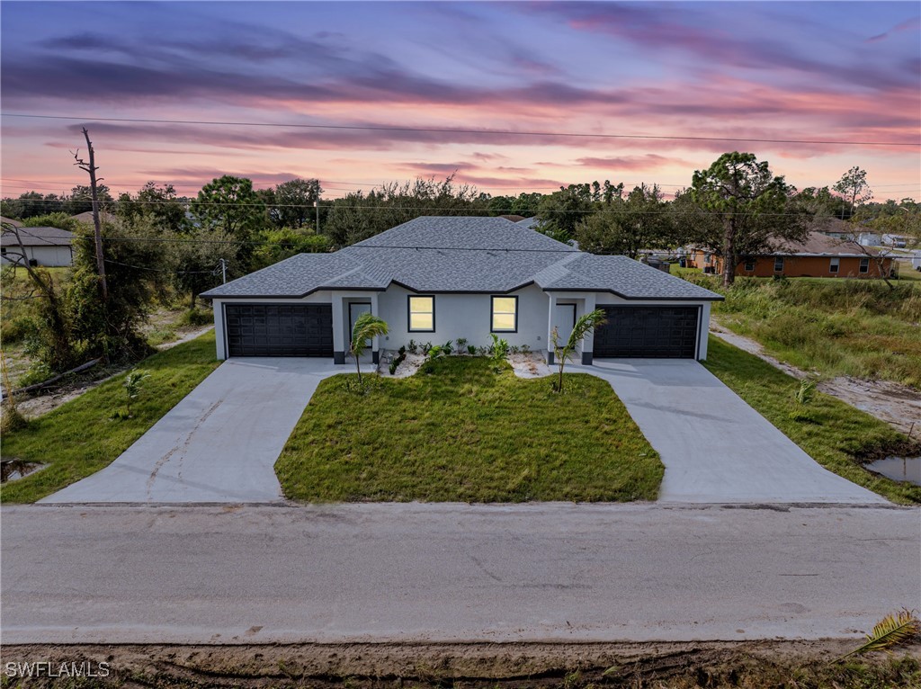 a front view of a house with a yard