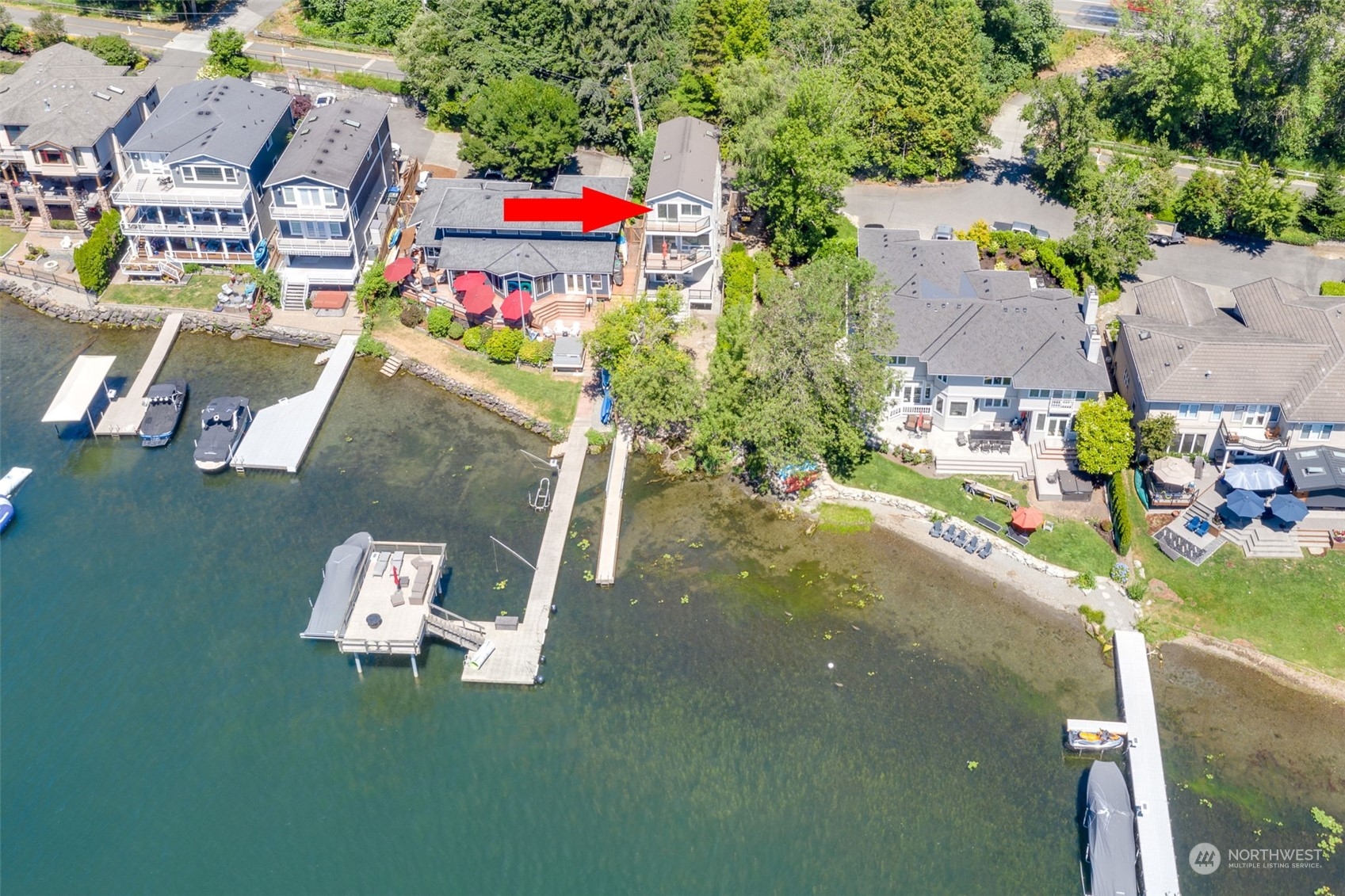 an aerial view of residential houses with outdoor space