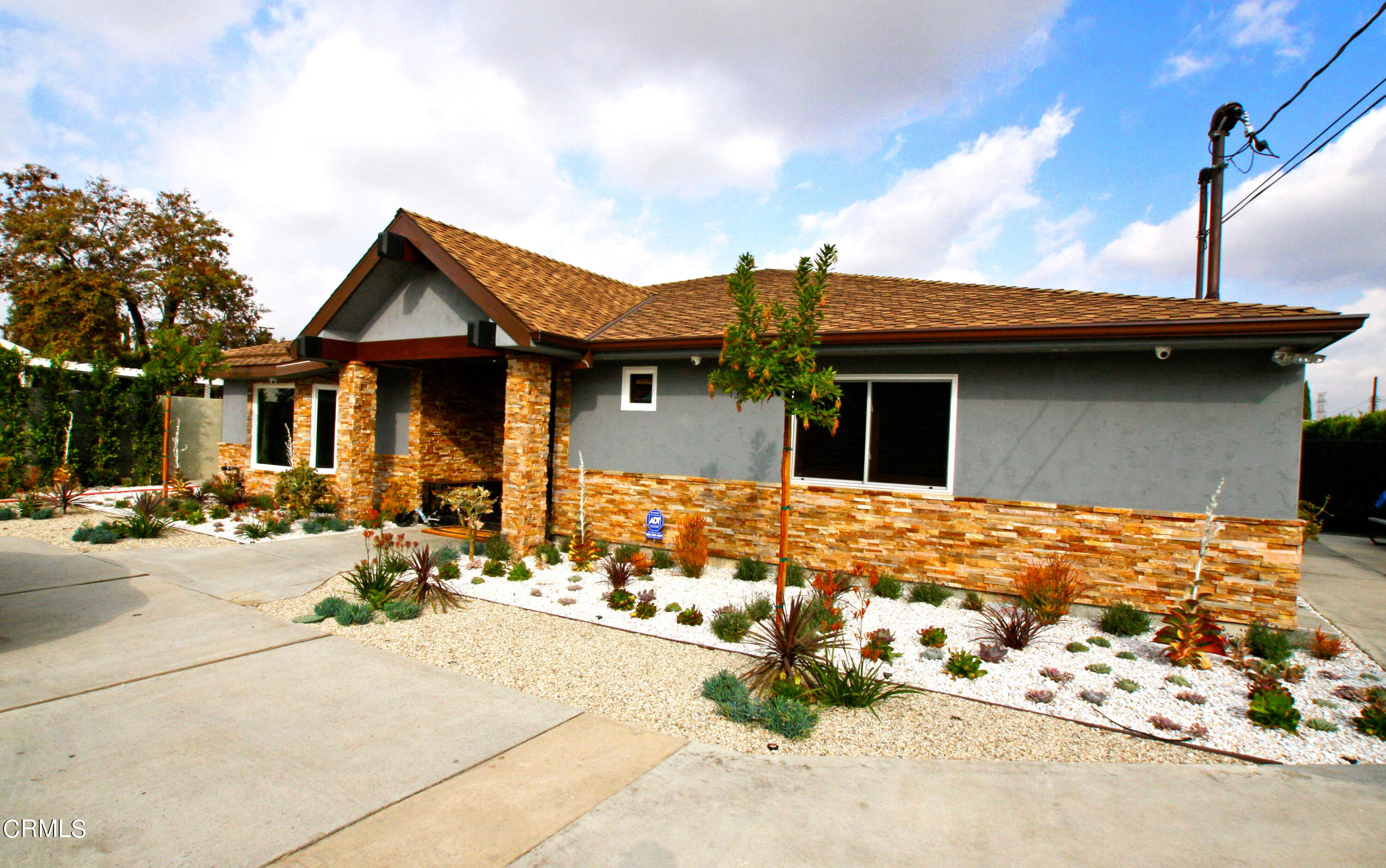 a front view of a house with patio