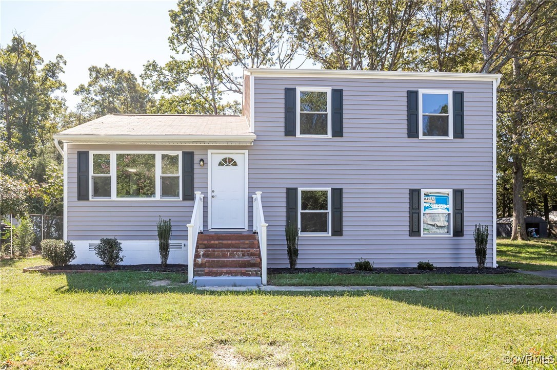 View of front of house with a front lawn