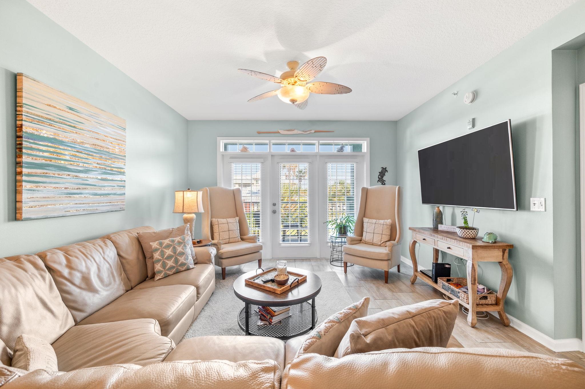 a living room with furniture and a flat screen tv