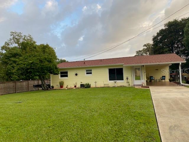 a view of a house with a back yard