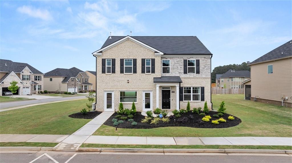 a front view of a house with a yard