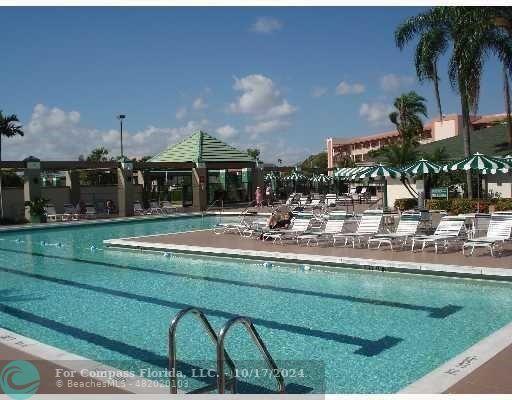 a view of swimming pool and outdoor seating