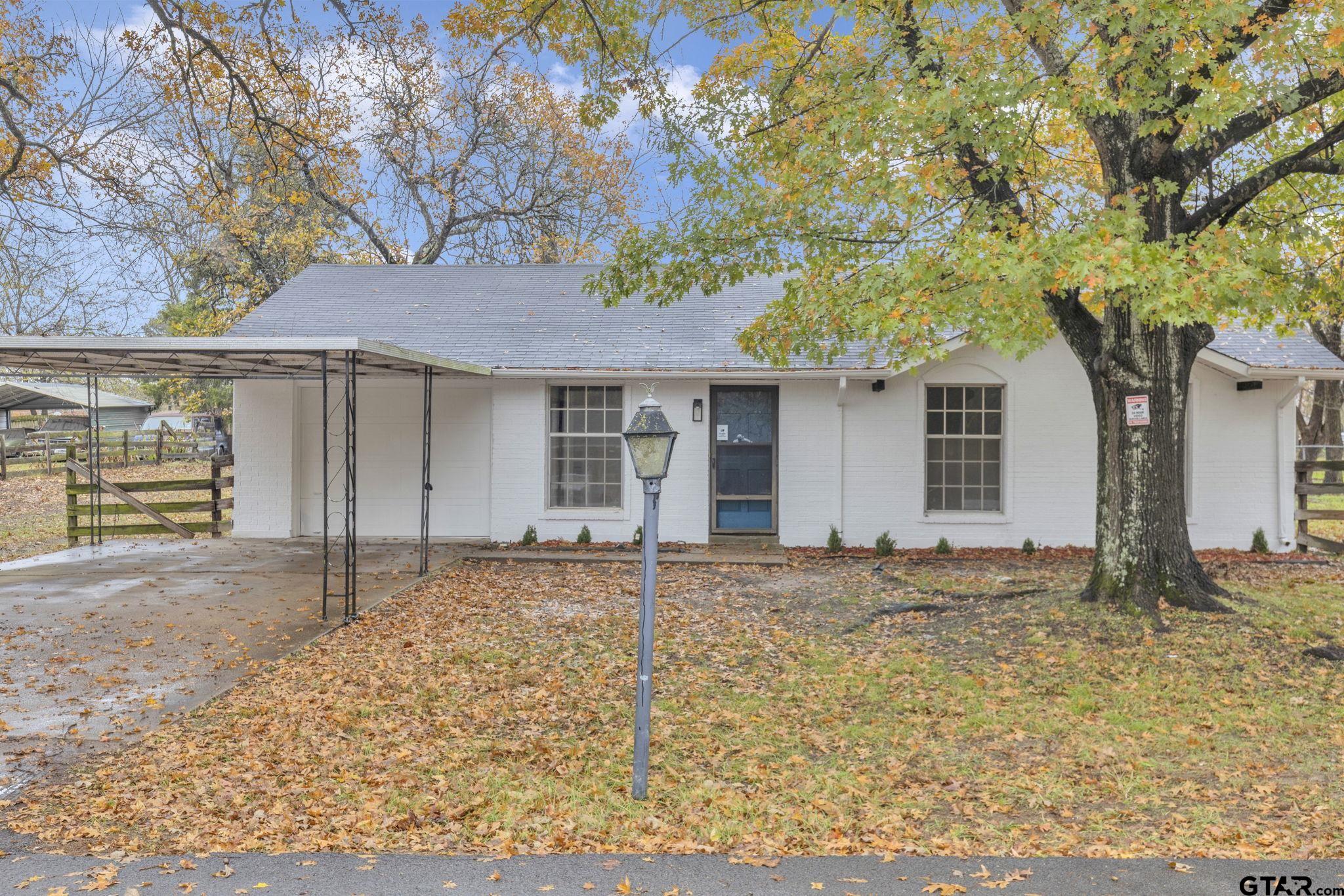 a house with trees in the background