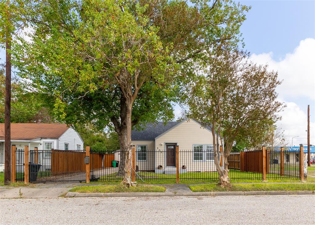 Excellent curb appeal with a beautiful iron fence that sets the tone for elegance and charm. This home invites you in from the very first glance!