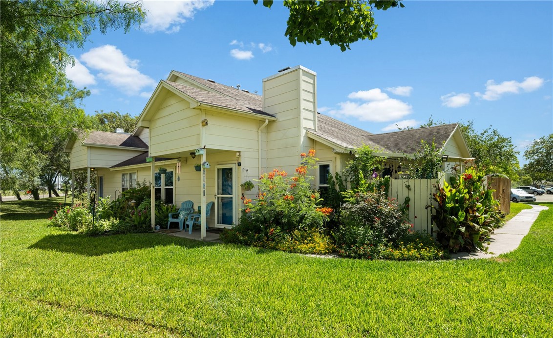 a view of a house next to a yard