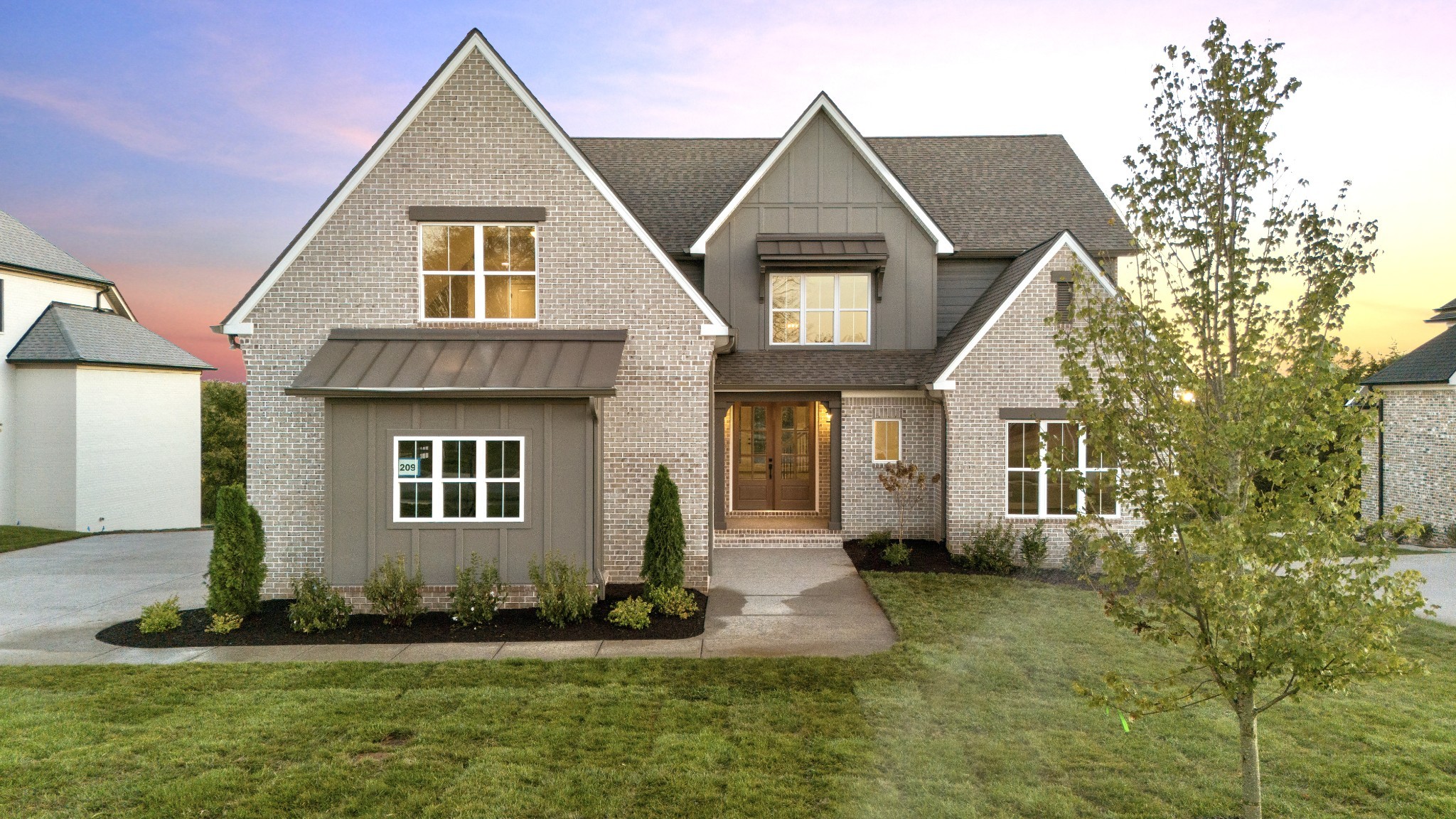 a front view of a house with a yard