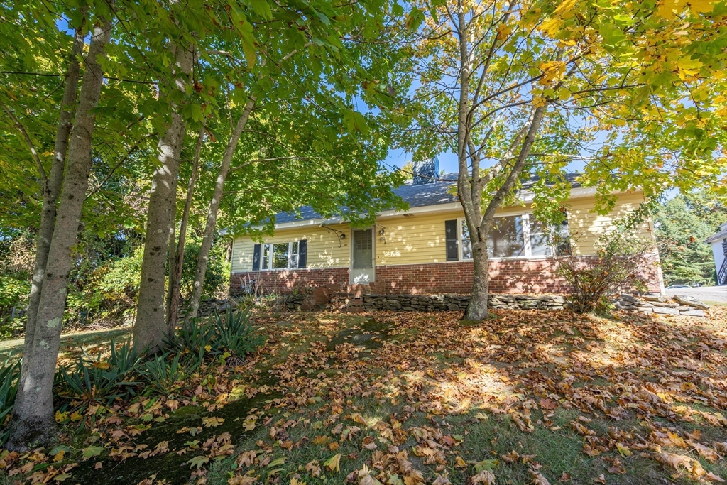 a view of a house with a tree