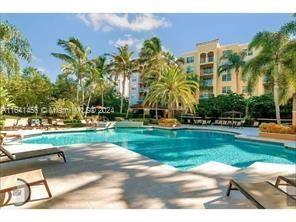 a view of a swimming pool and a yard