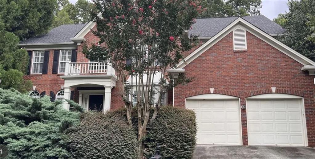 a front view of a house with yard