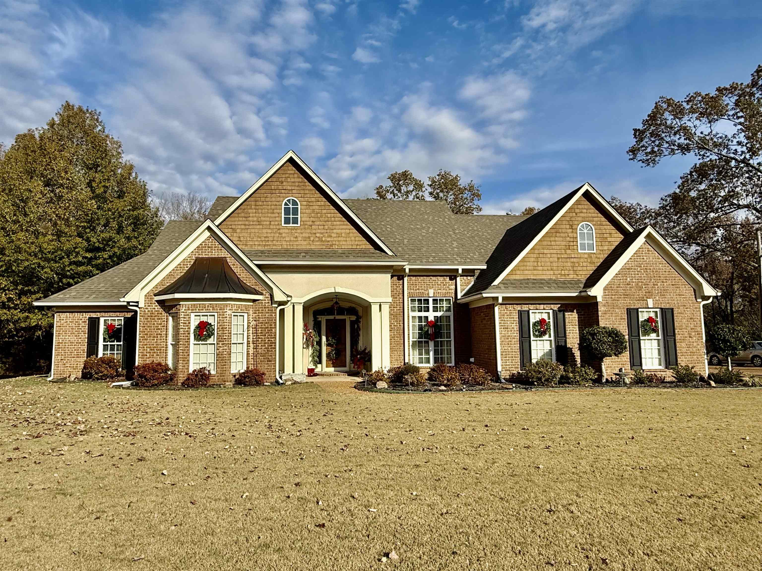 a front view of a house with a yard