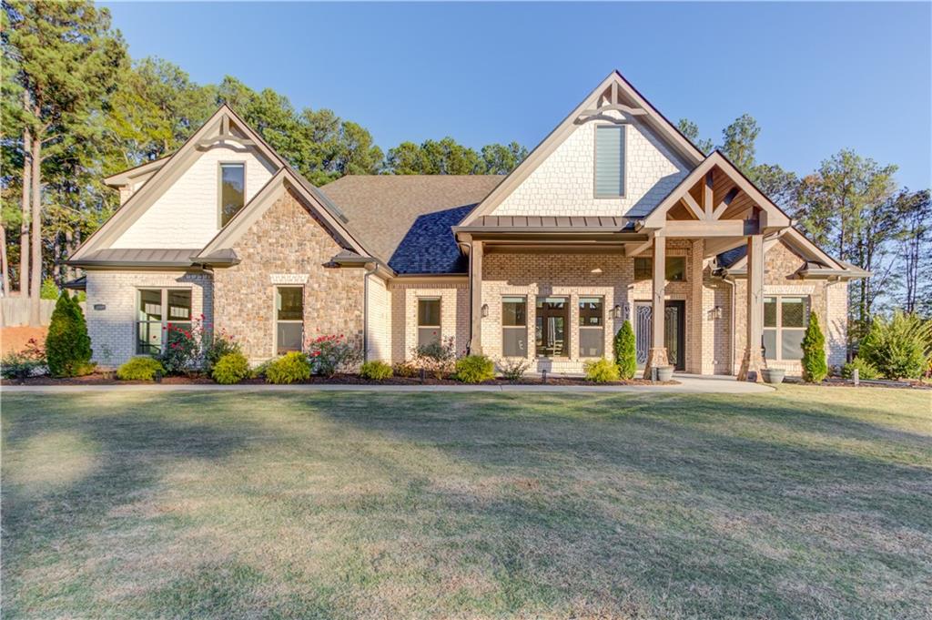 a front view of a house with a yard