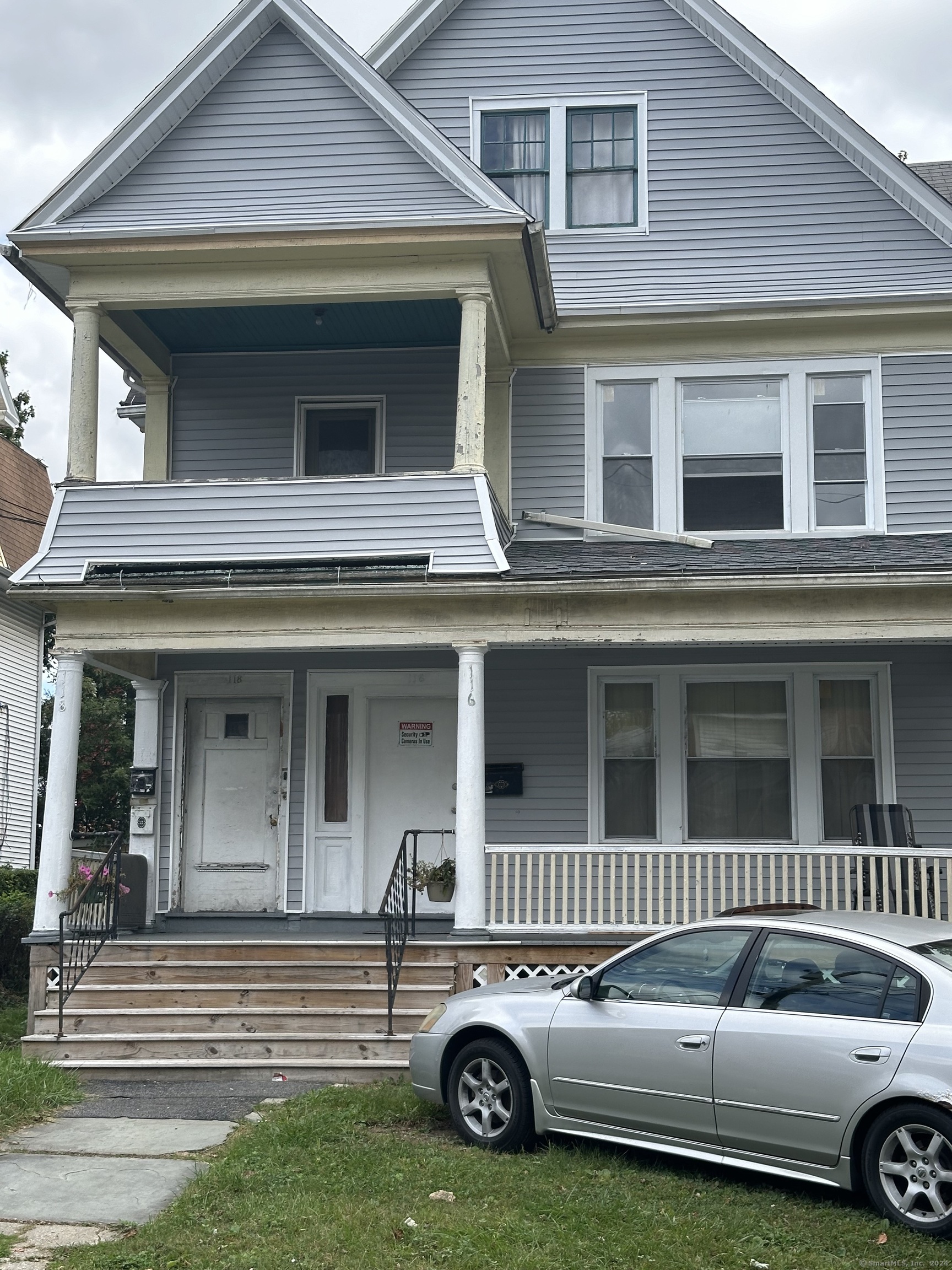 a view of a car parked in front of a house