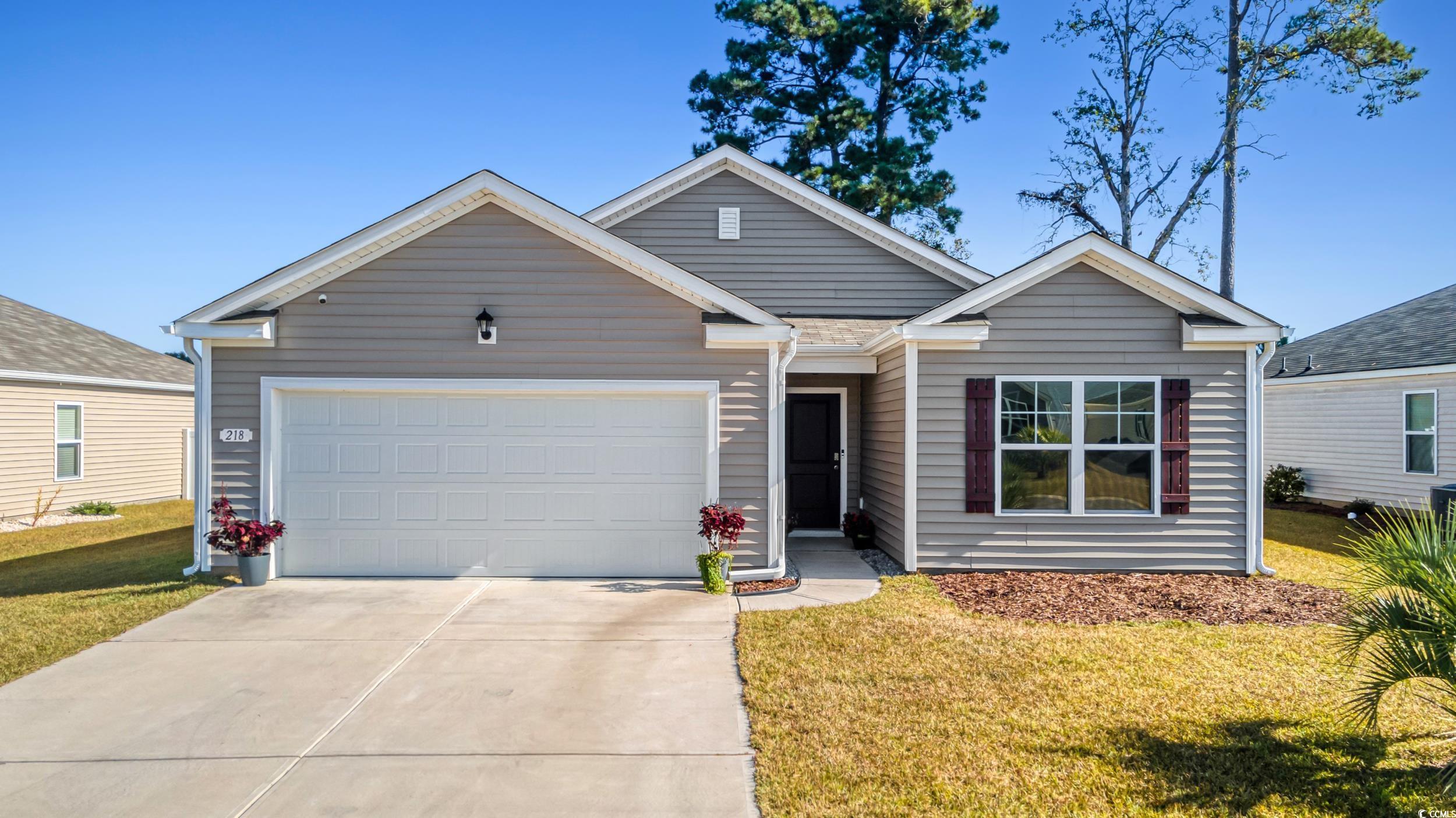 View of front of home featuring a front yard and a