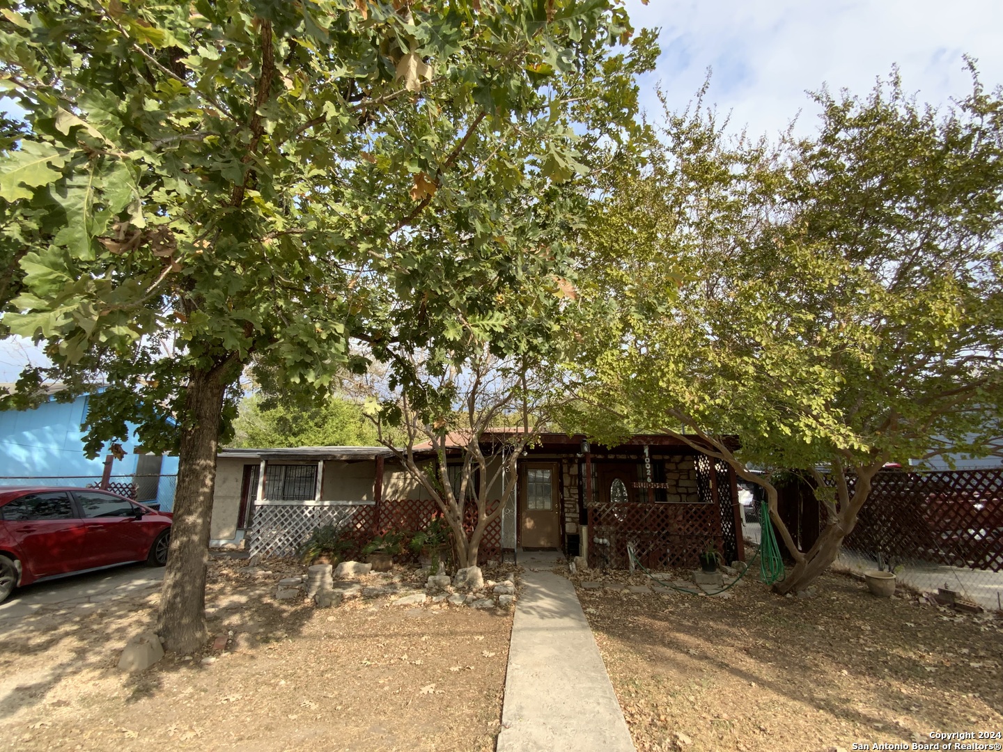 a view of a house with a tree