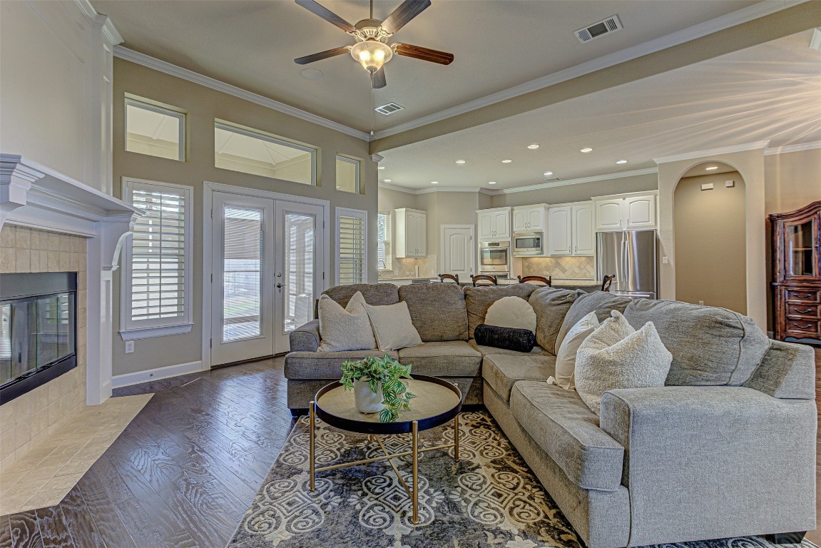 a living room with furniture and a fireplace