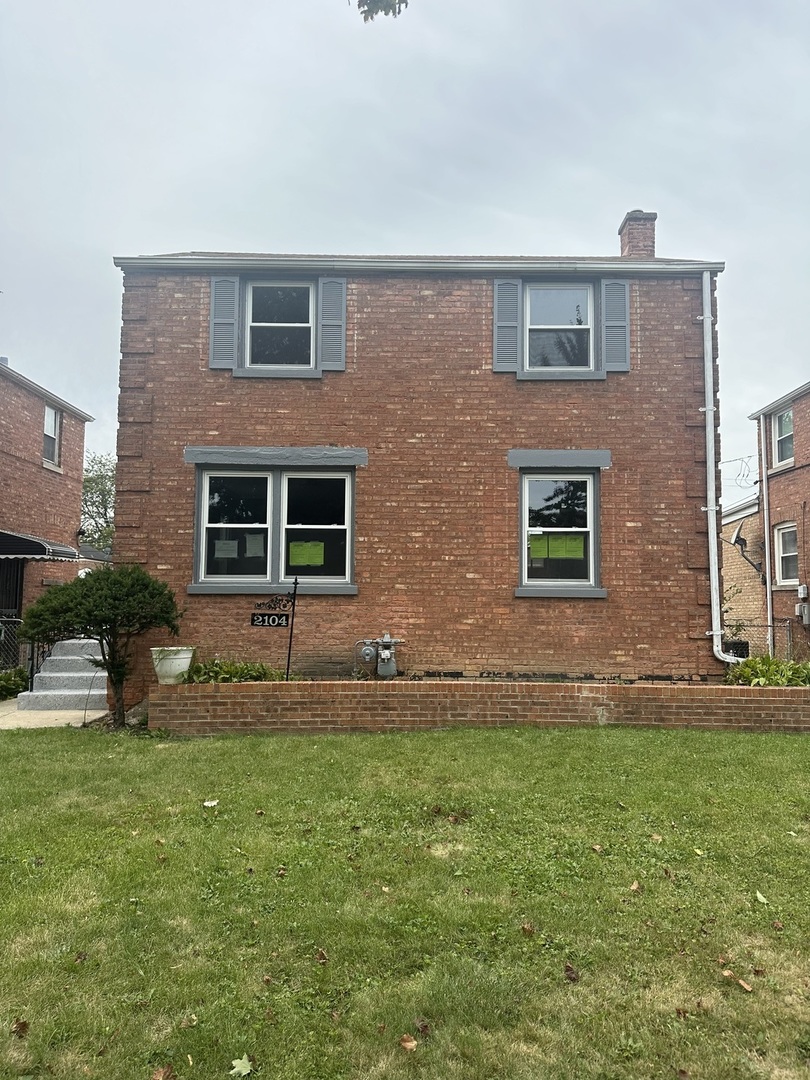 a front view of house with yard