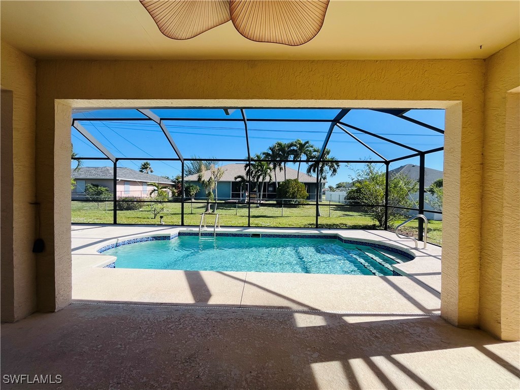 a view of yard with swimming pool