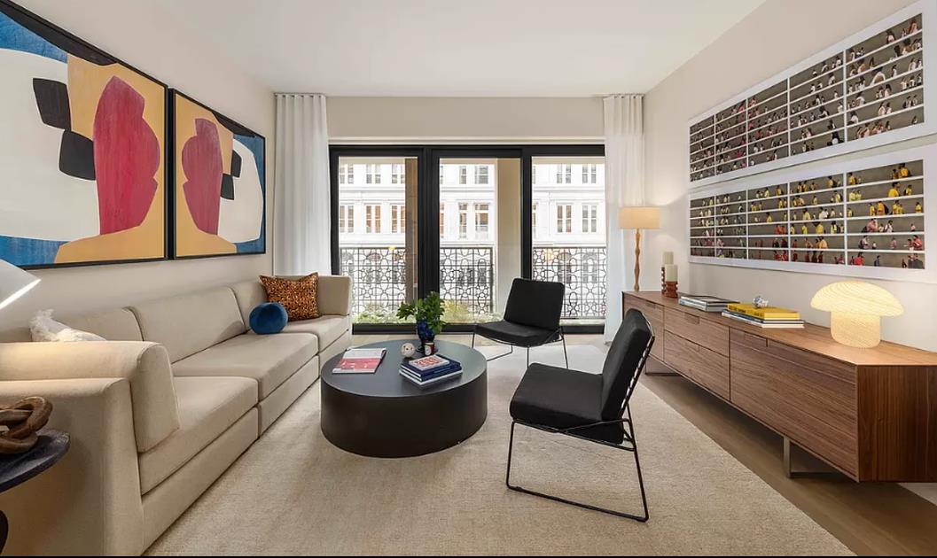 a living room with furniture and windows