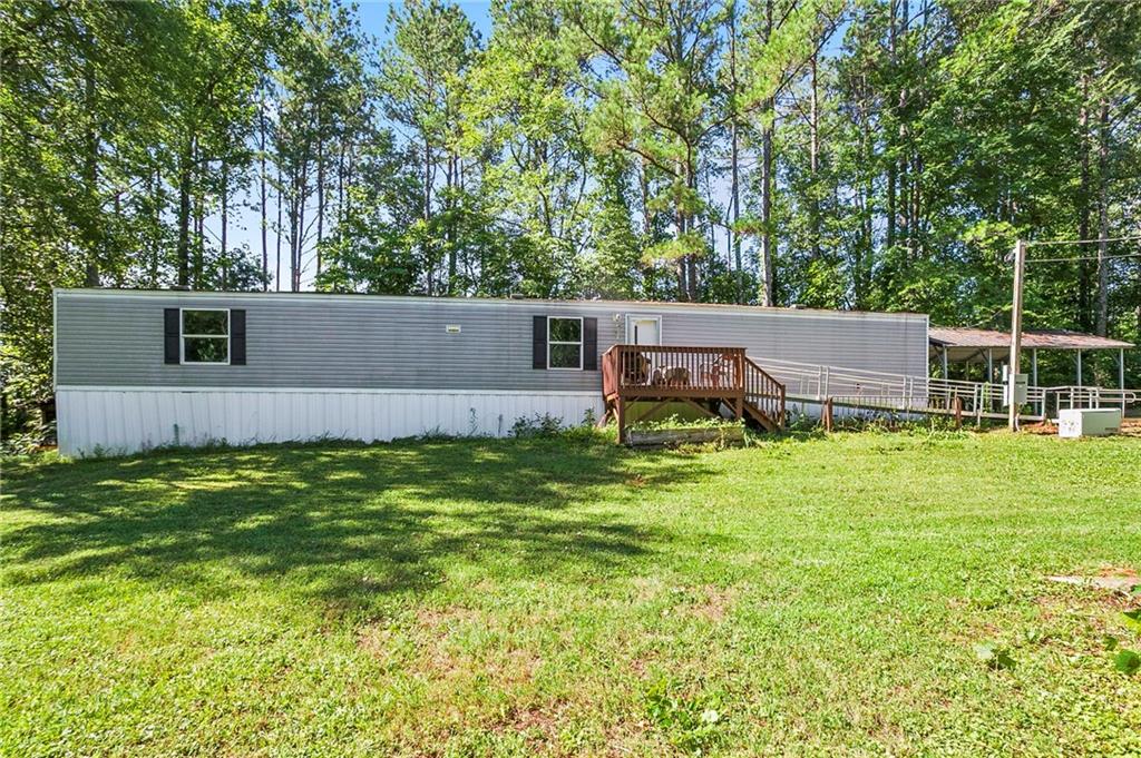 a view of a house with a backyard