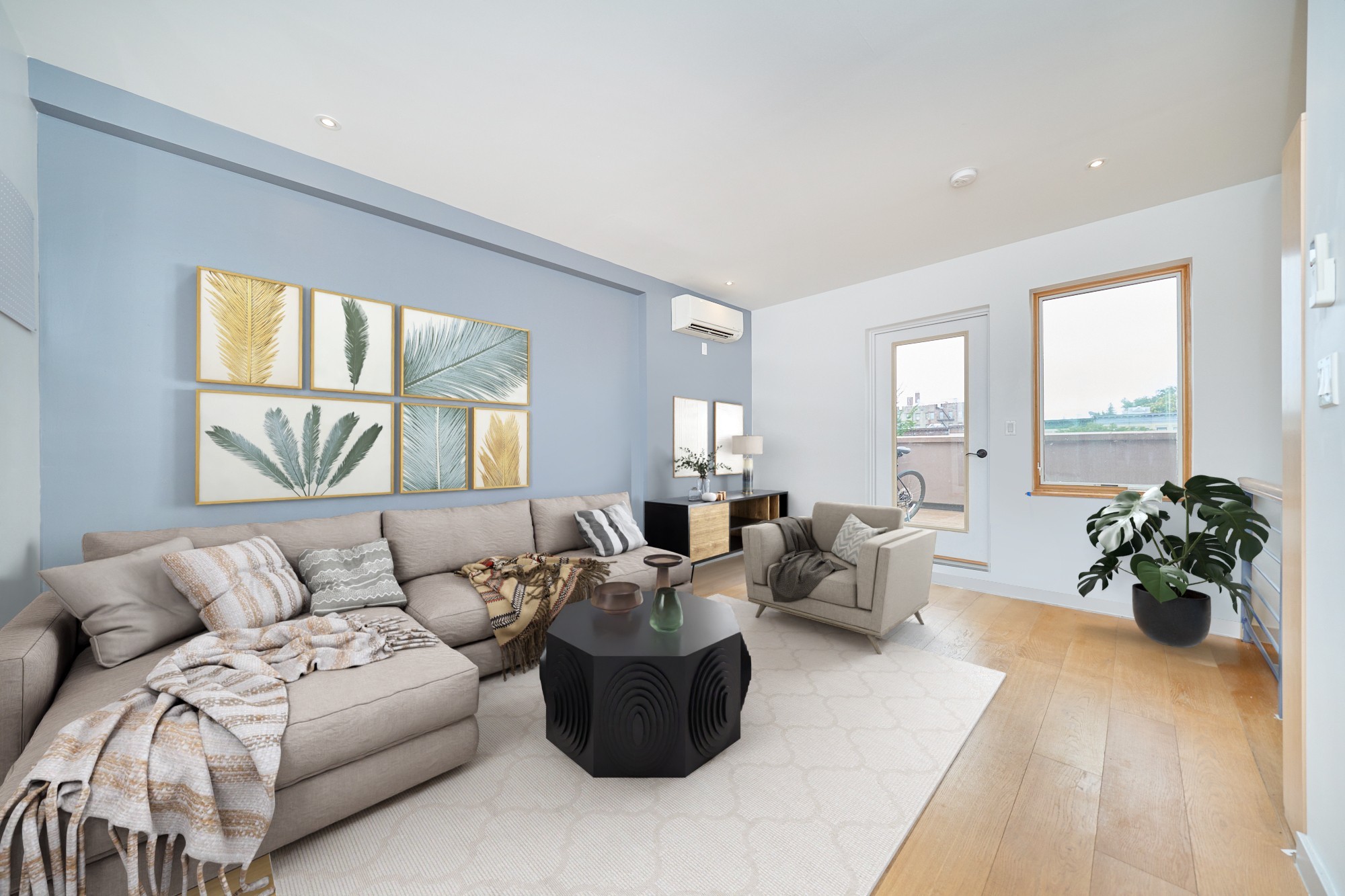 a living room with furniture and wooden floor