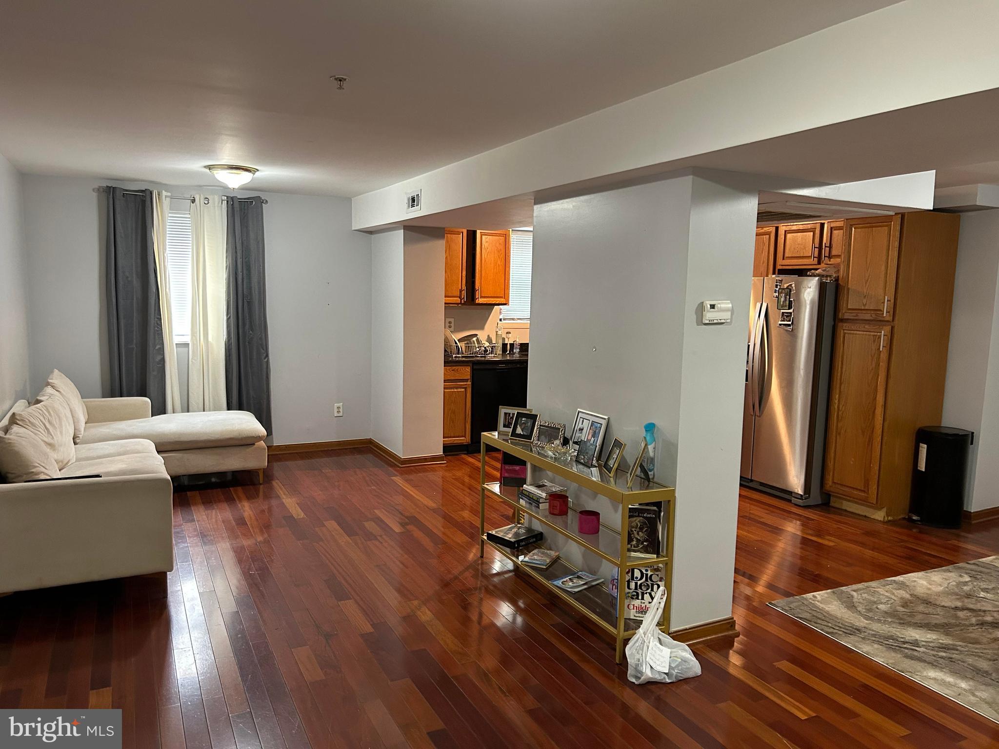 a bedroom with furniture and a wooden floor