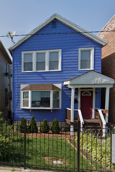 a front view of a house with glass windows