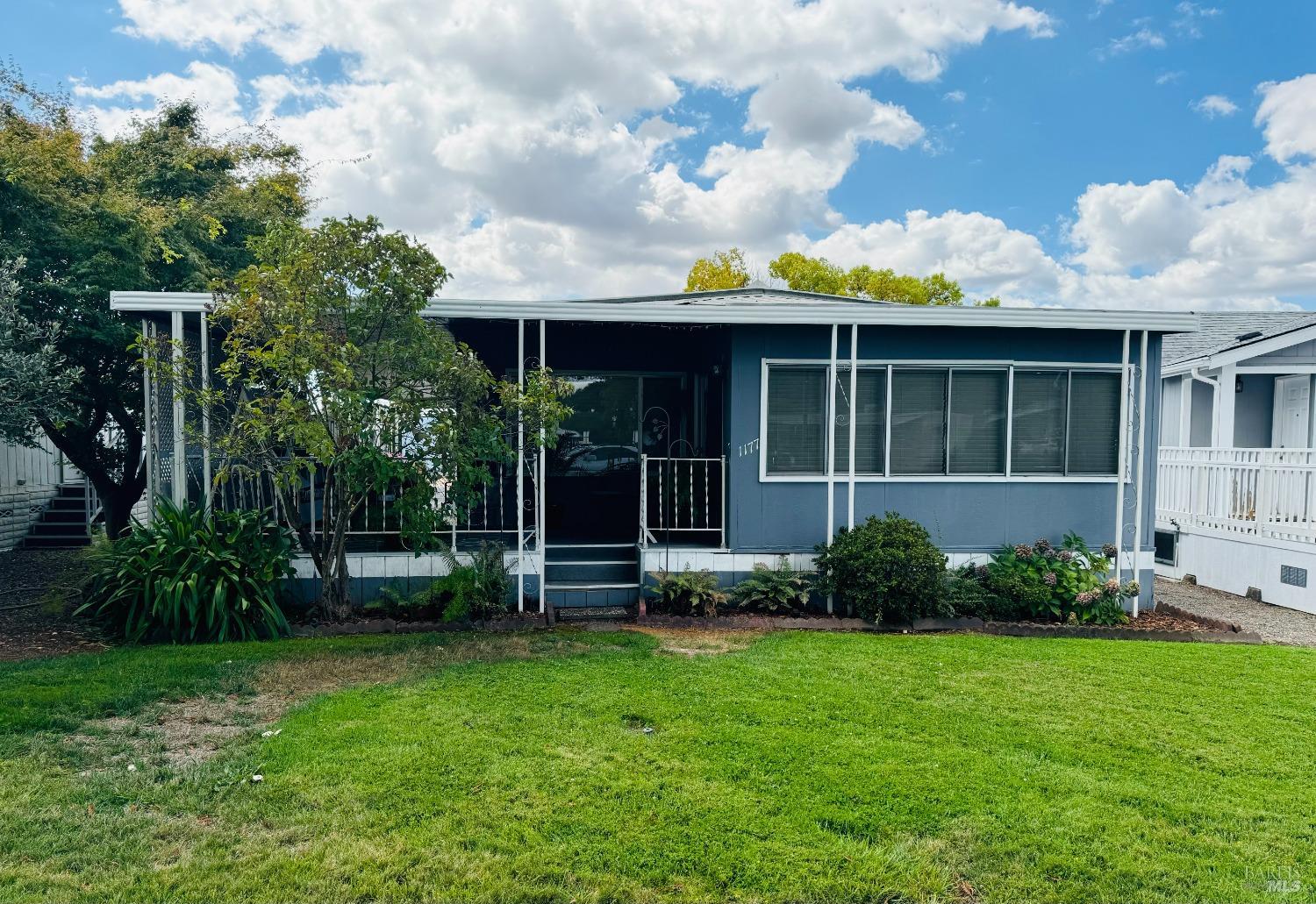 a view of house with backyard and garden