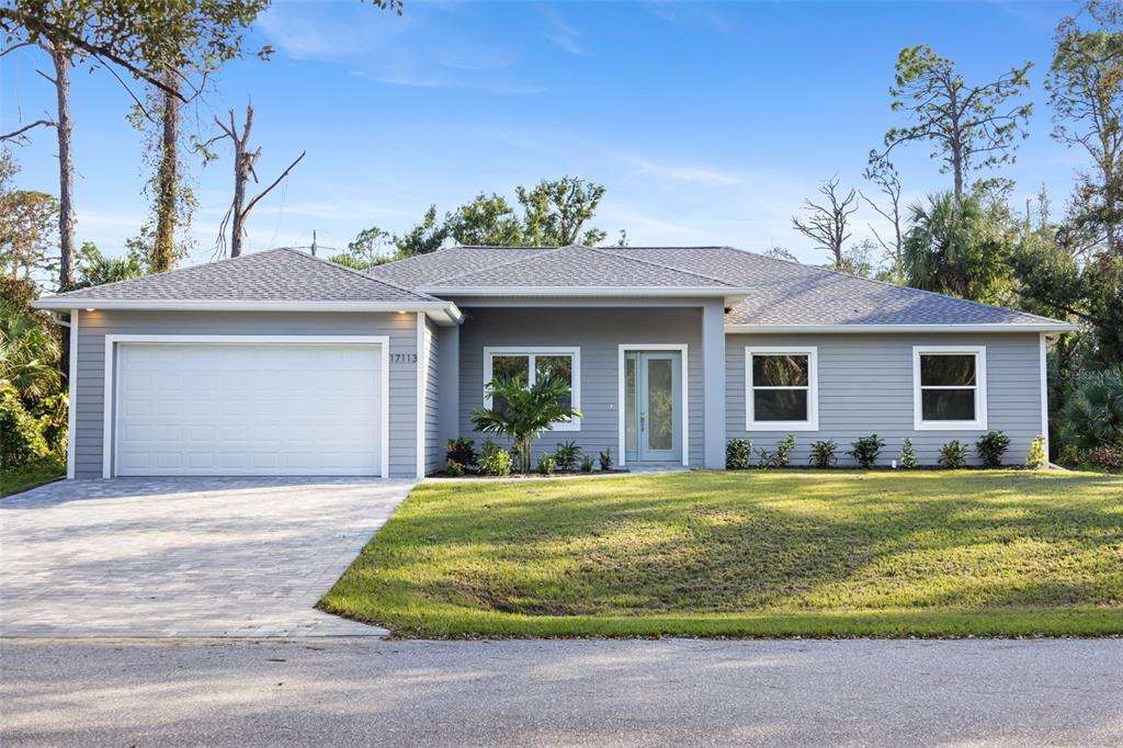 a view of a house with a yard