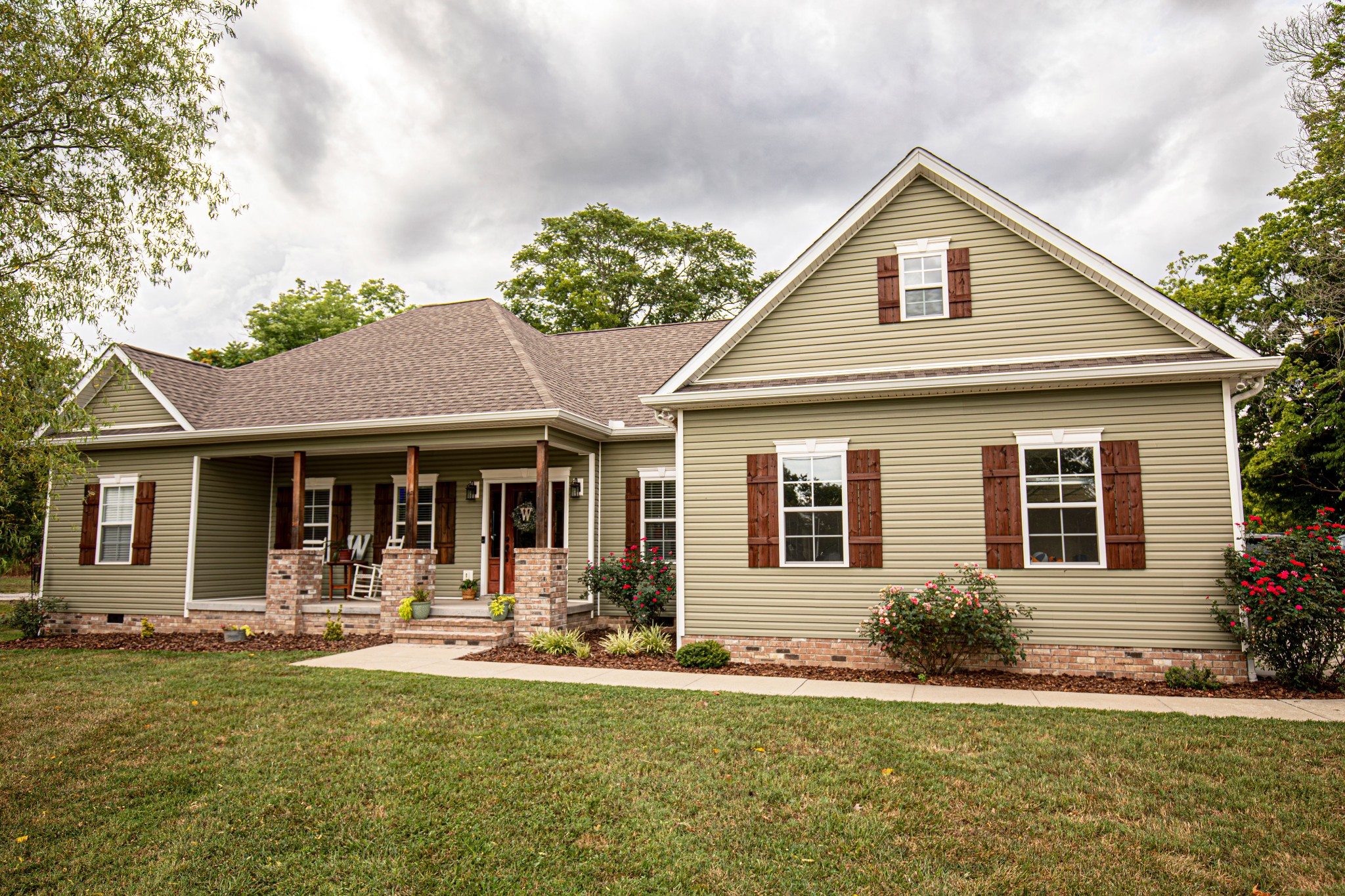 a front view of a house with a yard