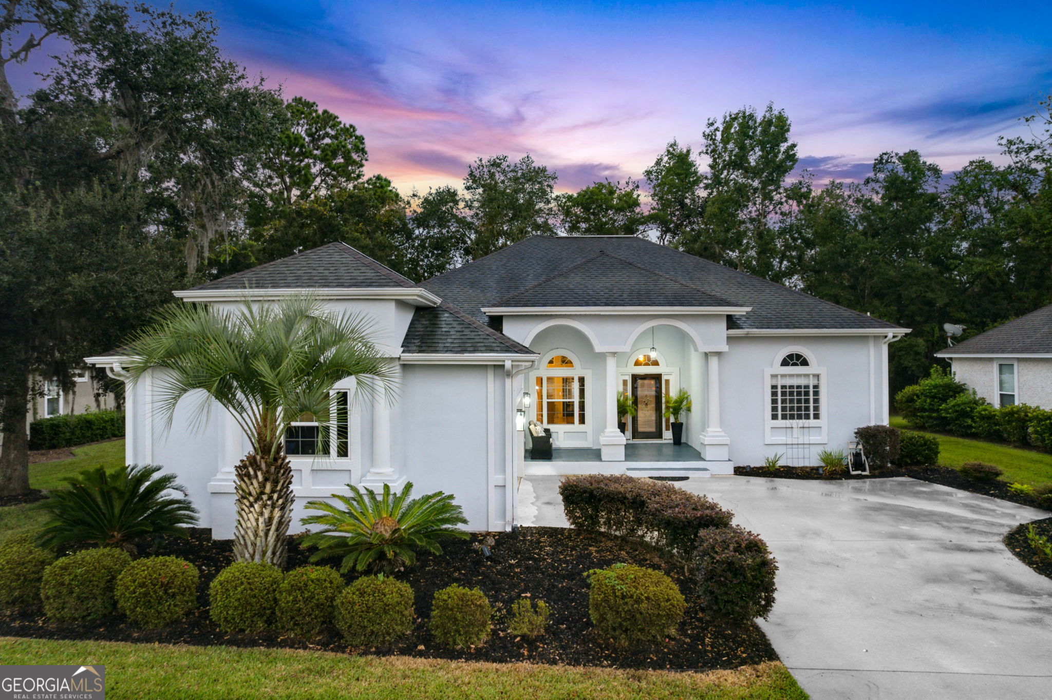 a front view of house with yard outdoor seating and green space