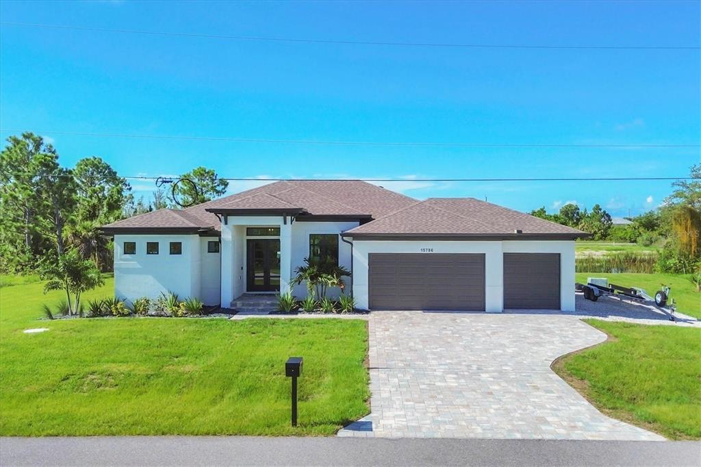 a front view of house with yard and green space