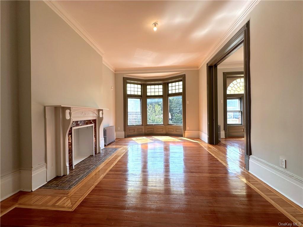 a view of an entryway with wooden floor