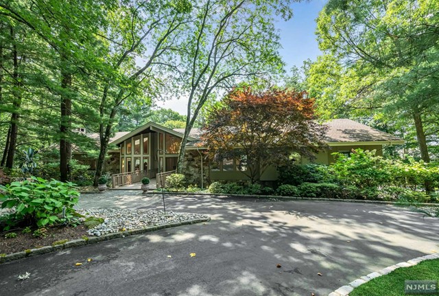 a view of a house with a tree in the background