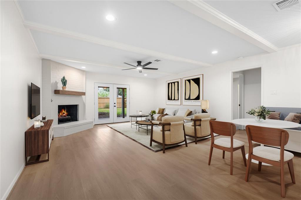 a living room with furniture fireplace and flat screen tv