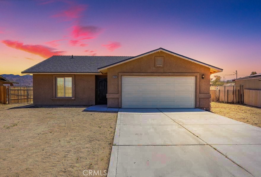 a front view of a house with a garage