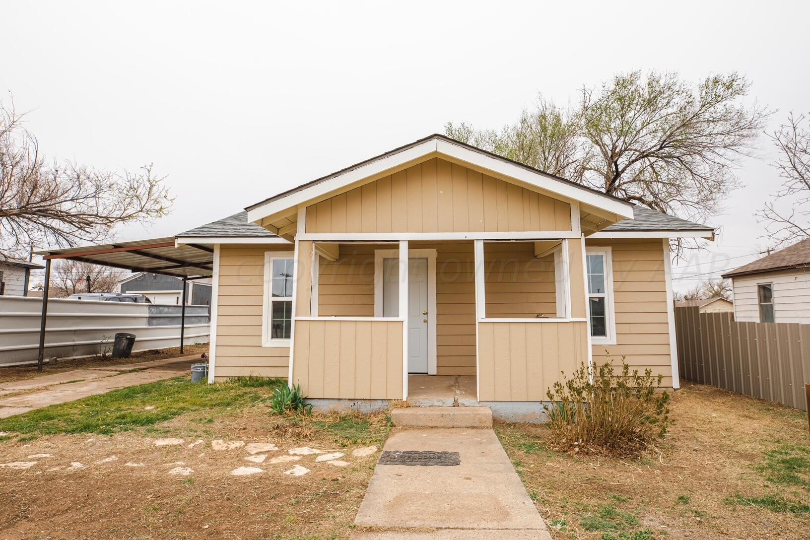 front view of a house with a yard