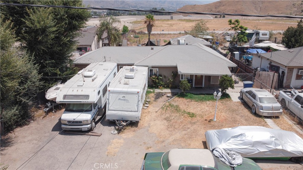 an aerial view of a house with table and chairs