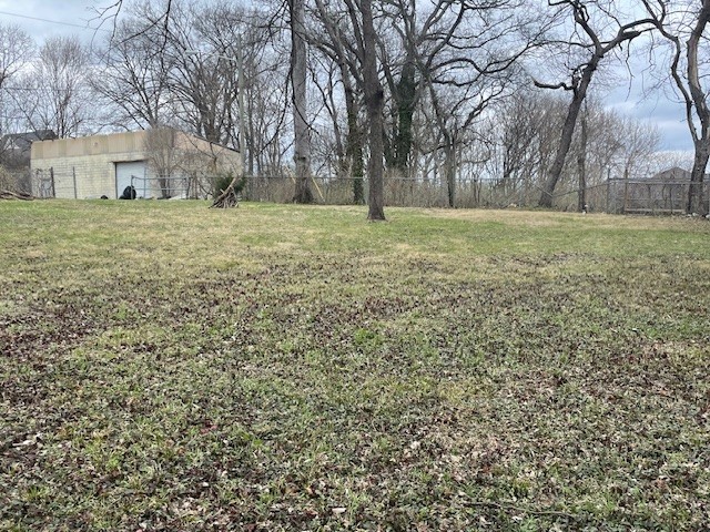 a view of a field with trees