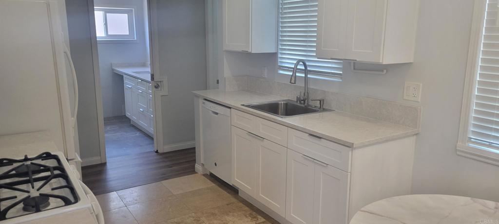 a kitchen with a sink and cabinets