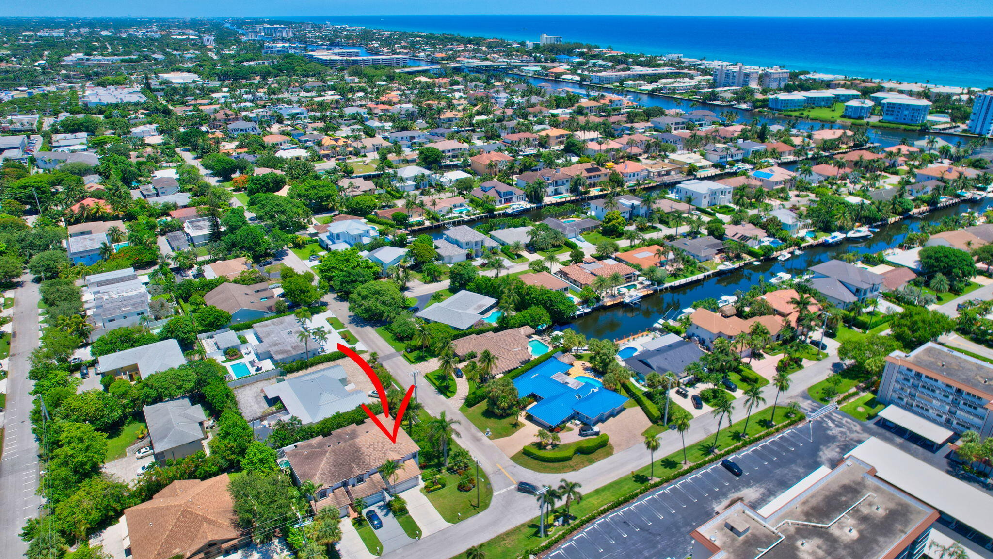 an aerial view of residential houses with outdoor space and street view