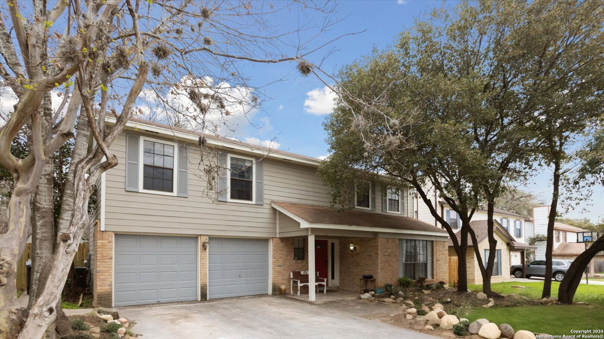 front view of a house with a yard